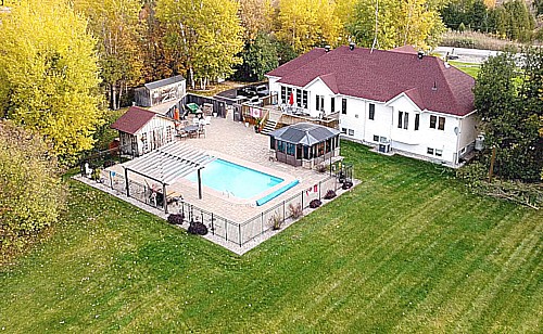 Luxury HOME Backyard landscape shot from a drone!