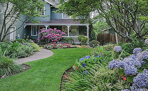 A shot of a beautiful landscape and garden of a home