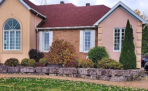 A shot of a beautiful garden at the front edge of a home